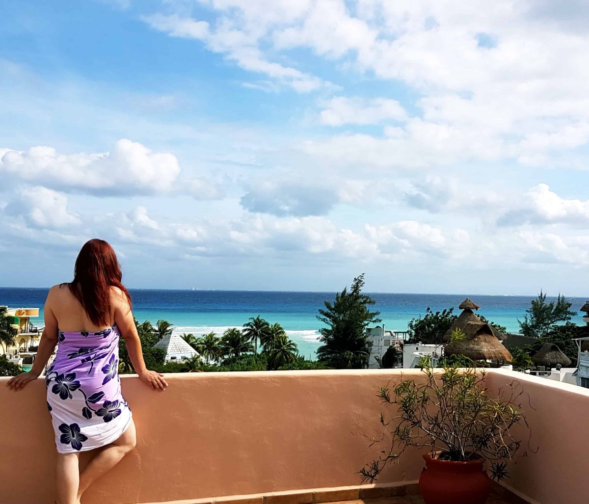 photo of me looking out on Caribbean taken with my tripod in Playa del Carmen