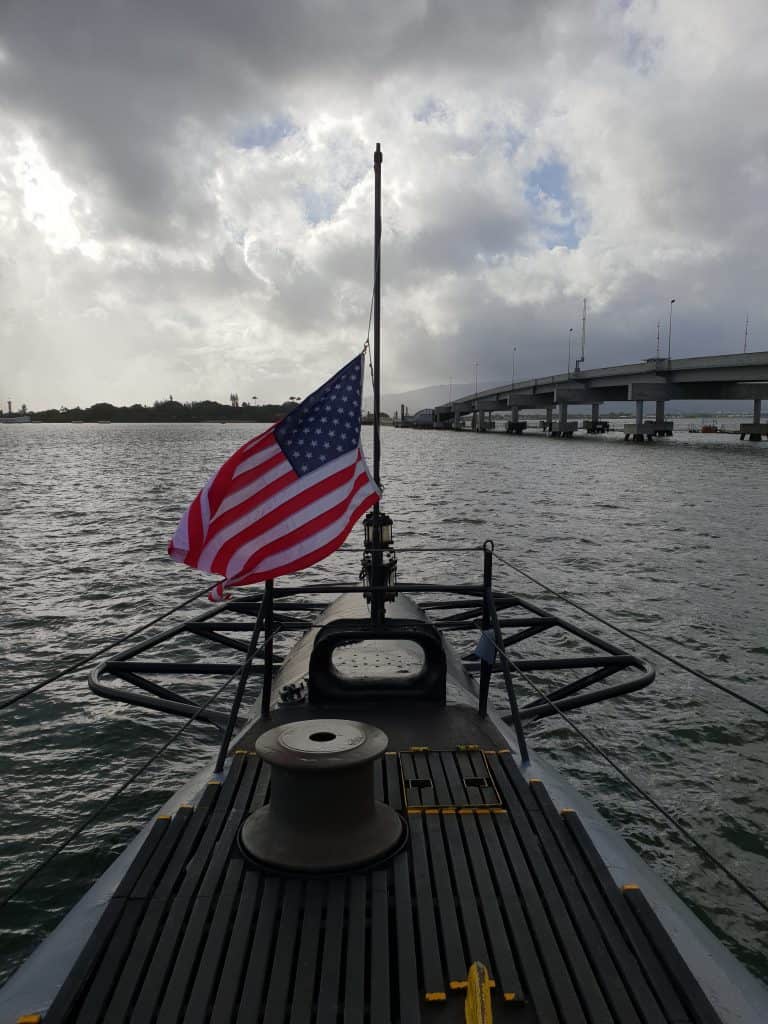 US flag flying at half mast on board the USS Bowfin at Pearl Harbor Hawaii