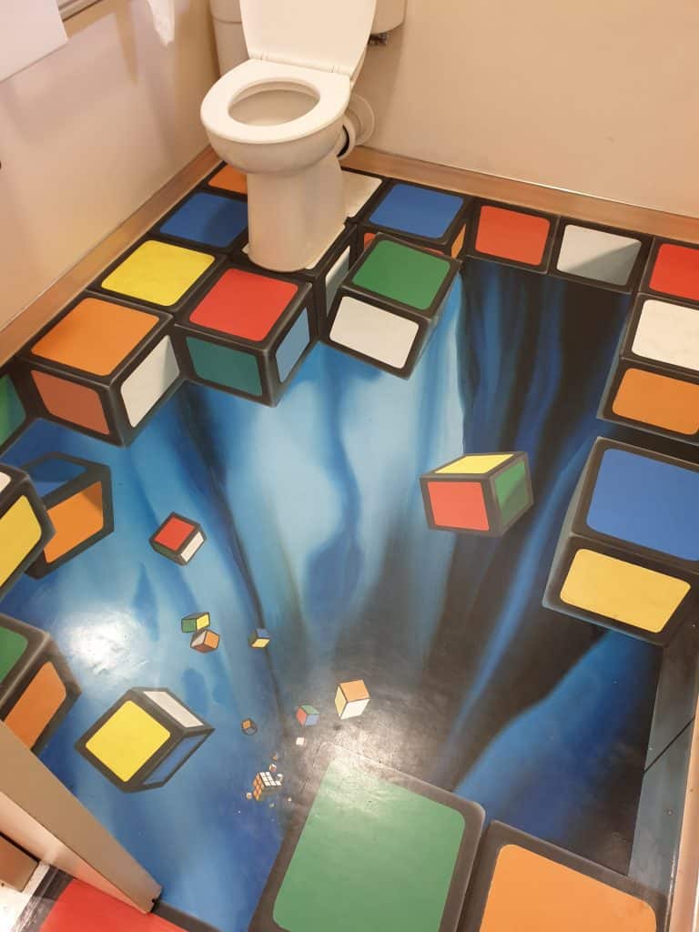 Bathroom with optical illusion floor at Puzzling World Wanaka