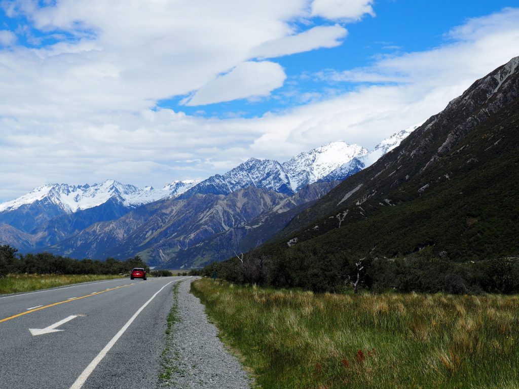 Image of road in New Zealand heading towards snow capped mountains