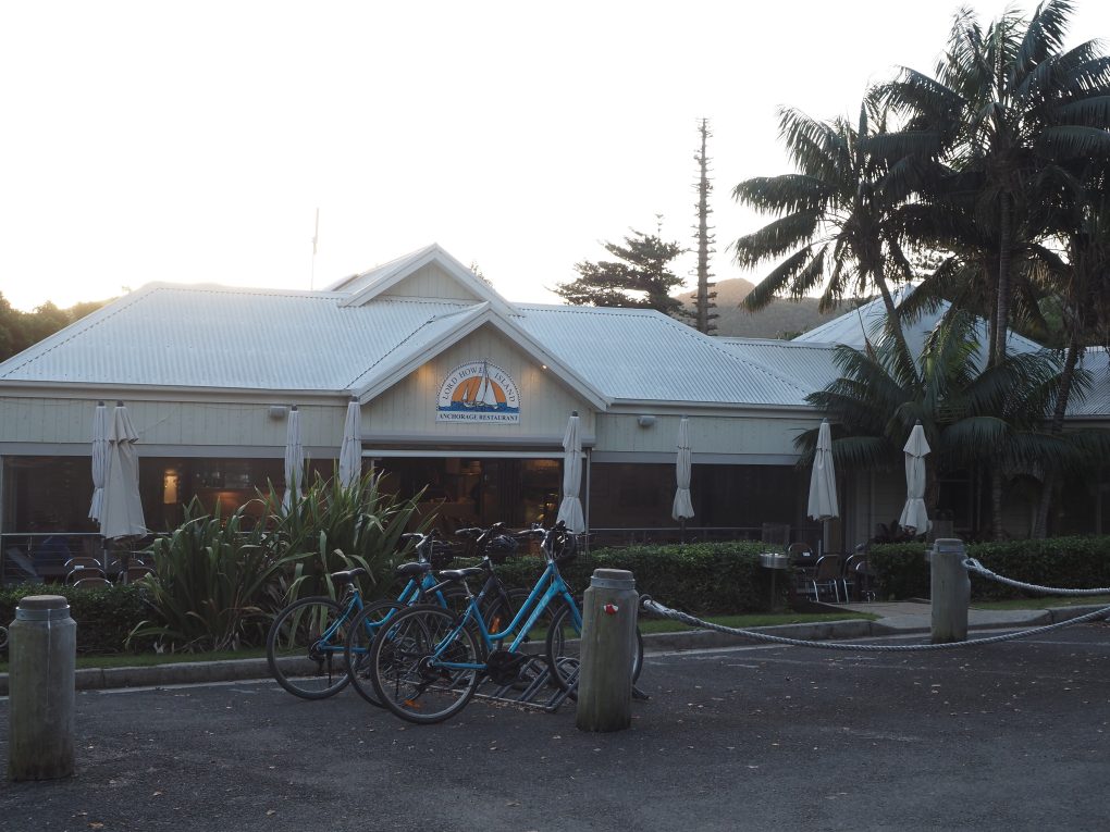 Frontage of The Anchorage Restaurant in Lord Howe Island. Several bikes are parked in a rack out the front. 